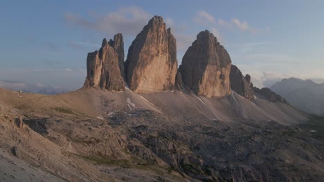 Tre-Cime-mountain-scenic-aerial-shot-with-drone-in-the-Italian-alps,-Dolomites-during-sunset