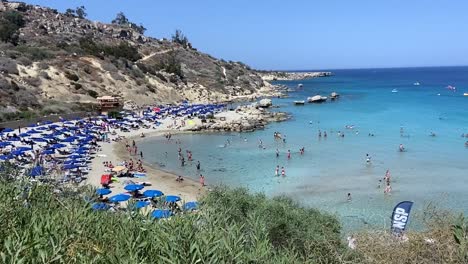Panoramic-view-of-crowd-of-tourists-at-Konnos-Beach-on-Cyprus-Island