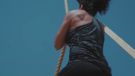 Tough-Female-Athlete-climbing-the-rope-perfectly---Slow-Motion