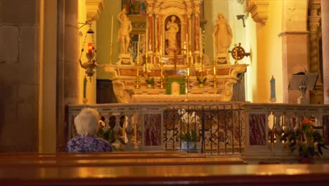 Old-lady-praying-inside-a-christian-church
