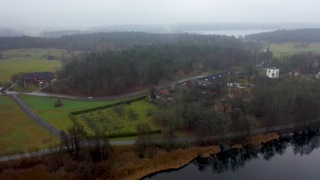 Panning-aerial-footage-of-Stora-Skuggan,-a-nature-park-located-next-to-Stockholm-University-in-Sweden