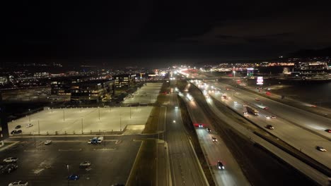Traffic-along-a-highway-at-nighttime---aerial-hyper-lapse