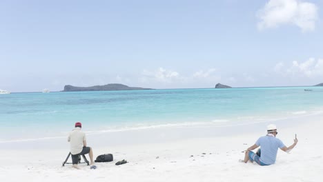 A-white-sand-and-turquoise-water-beach-of-the-Galapagos-islands-in-Ecuador