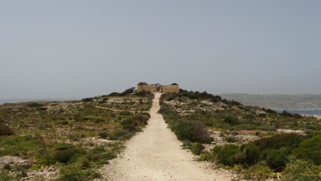 Building-On-A-Hill-At-The-End-Of-The-Path-In-Comino-Island
