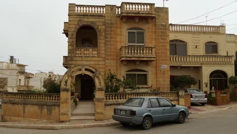 Car-Parking-In-Front-Of-A-Townhouse-In-Gozo,-Malta