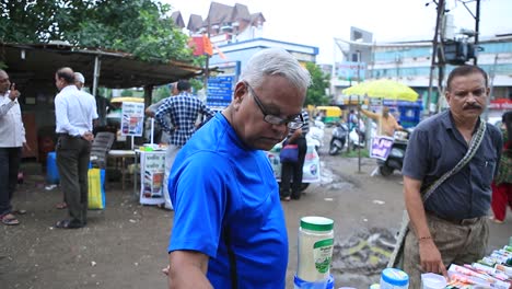 local-vender-showing-best-herbal-product-to-customers,-close-shoot-of-local-market