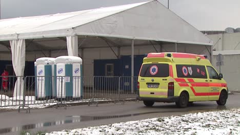 Ambulance-car-parked-outside-of-emergency-hospital-tents-in-time-of-coronavirus-outbreak