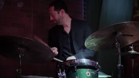 A-white-ambitious-musician-is-playing-drums-at-a-Chicago-restaurant-Andrews-jazz