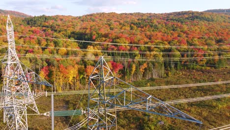 Transmission-Towers-With-Autumn-Forest-In-Montreal,-Quebec,-Canada