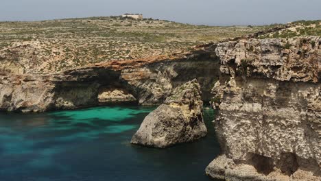 Small-Islet-In-The-Crystal-Lagoon-In-Comino-Island