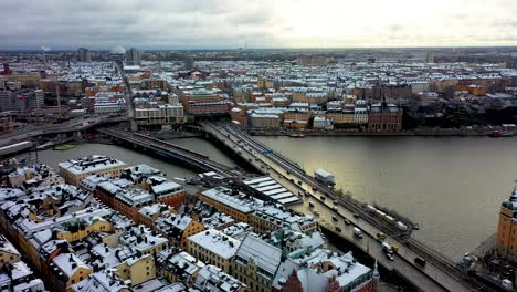 Drone-footage-of-the-traffic-along-Gamla-Stan,-the-old-town-located-in-Stockholm,-Sweden