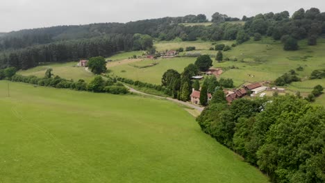 Aerial-Flyover-of-English-Rural-Fields,-with-Country-Lanes-and-Houses