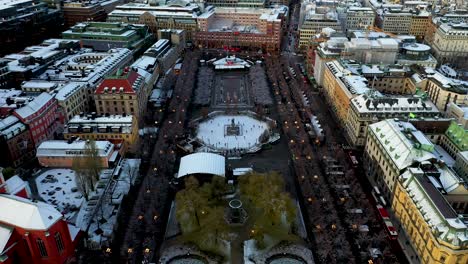 Aerial-footage-of-the-ice-skating-rink-located-in-Kungstragarden,-a-park-in-Stockholm-Sweden's-city-centre