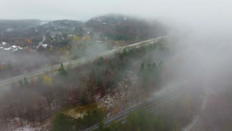 Mist-over-rural-forest-area-and-road-near-Mount-Washington,-New-Hampshire,-USA