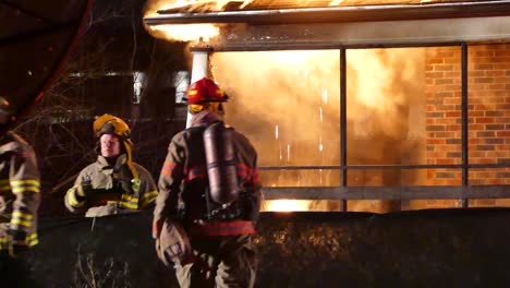 Close-Up-View-Of-Firefighters-Attending-To-Burning-House-Fire---Brampton,-Canada