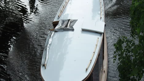 Touristic-Boat-Sailing-in-Dougava-River-Water-Canal,-Riga,-Latvia
