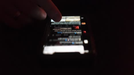Timelapse-of-person-scroll-social-media-feed-on-smartphone-during-night