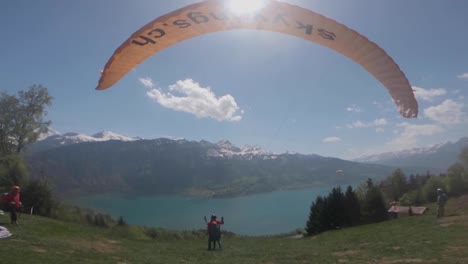 Amazing-Launch-Of-A-Para-glider's-Parachute-In-Switzerland---wide-shot