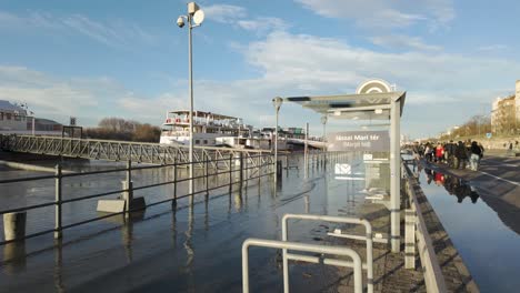 Ferry-dock-station-of-"Jaszai-Mari-Square"-at-Margaret-Bridge,-at-the-shore-of-River-Danube-during-the-flooding-of-the-river-at-Budapest,-Hungary---December-26,-2023