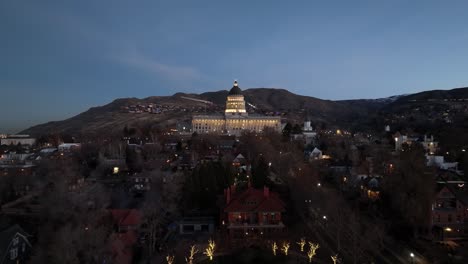 Salt-Lake-City,-Utah-state-capitol-building-at-twilight---pullback-aerial