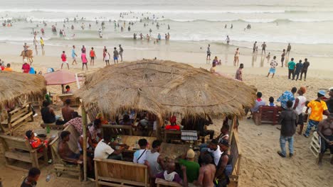 people-gathering-on-west-ghana-coastline-of-africa-during-a-family-weekend