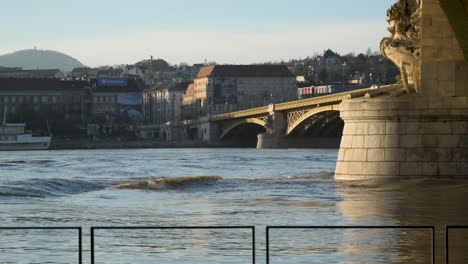 Slow-Motion-shot-of-Huge-Waves-on-Danube-River-during-flooding-at-Margaret-Bridge,-Budapest,-Hungary