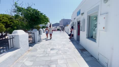 Oia-Santorini-Greece-Island-Travel-Tourist-Immersive-Walk,-Europe,-4K-|-Greek,-Aegean,-Sea,-Cliffside,-Ocean,-City,-Vacation,-Shopping,-White,-Marble,-Crowd,-Flowers,-Traveler,-People,-Elder,-Couple