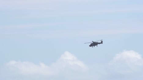 Tracking-shot-of-a-navy-lynx-helicopter-above-Bournemouth,-England