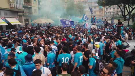 Crowd-of-SSC-Napoli-Fans-celebrating-win-of-Serie-A-Championship-2023-in-city-center---top-wide-shot