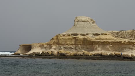 Telephoto-Shot-Of-Rock-Formation-In-Xwejni-Bay,-Near-The-Salt-Pans-In-Zebbug,-Gozo
