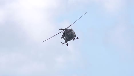 Navy-helicopter-Lynx-making-a-turn-in-slow-motion,-Bournemouth,-Egland
