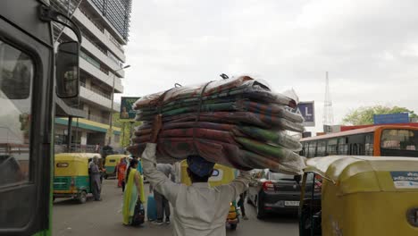 Indian-Man-Carrying-a-big-bundle-on-his-head,-Delhi-India
