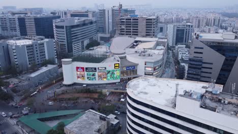 Drone-shot-Jubilee-Hills,-Inorbit-Mall-and-Financial-District-of-New-Hyderabad-City-with-modern-skyscrapers,-India