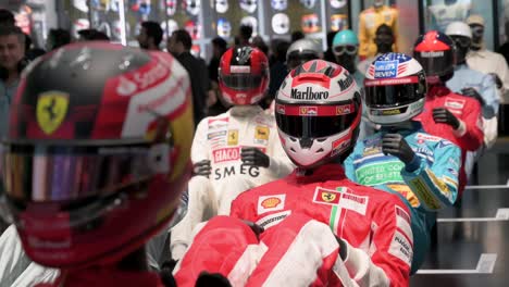 Mannequins-dressed-in-racing-suits-highlight-their-evolution-through-the-F1-sport-and-time-during-the-world's-first-official-Formula-1-exhibition-at-IFEMA-Madrid-in-Spain