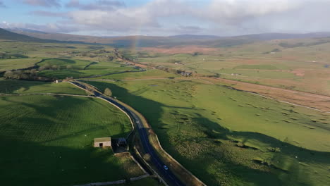 Establishing-Aerial-Drone-Shot-of-Yorkshire-Dales-Landscape-with-Rainbow