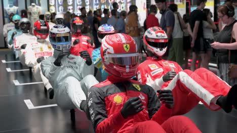 Mannequins-dressed-in-racing-suits-highlight-the-evolution-of-the-F1-sport-and-safety-through-time-during-the-world's-first-official-Formula-1-exhibition-at-the-IFEMA-Madrid-in-Spain