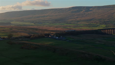 Establishing-Shot-of-Dales-with-Train-Coming-into-Ribblehead-Station-UK