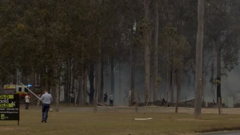 Emergency-services-responding-to-an-out-of-control-rural-fire-destroying-homes
