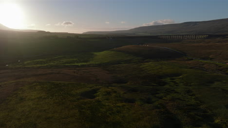 Establishing-Drone-Shot-of-Yorkshire-Dales-with-Ribblehead-Viaduct-Distant