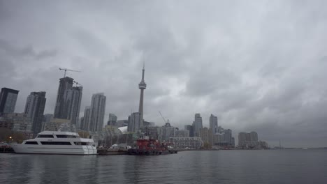 Shot-of-boats-moored-at-the-Toronto,-Harbourfront-with-the-city-skyline-in-the-background