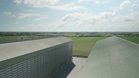 View-From-Roof-Of-Large-Wheat-Grain-Stores-With-Countryside-In-The-Distance