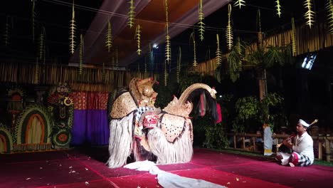 Barong-Dance-Performance,-Evening-at-Bali-Temple-Ceremony,-Mythological-Theater-of-Sacred-Animal,-Cultural-Ritual-of-Purification,-Ubud
