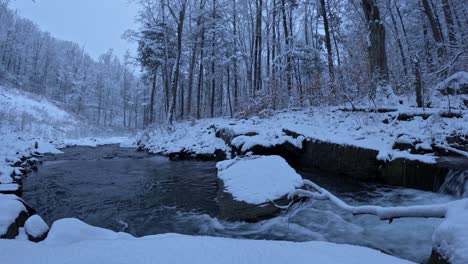 Stunning-time-lapse-footage-of-a-snowy-stream-in-a-winter-wonderland