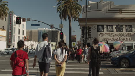 Cinematic-shot-of-people-crossing-the-street-on-Hollywood-Blvd