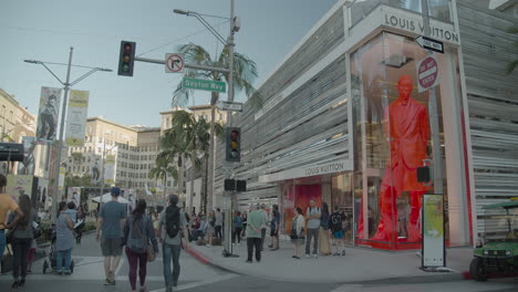 Shoppers-and-tourists-walking-by-the-Louis-Vuitton-store-in-Beverly-Hills-on-Rodeo-Drive
