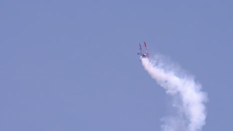 Slow-motion-shot-of-muscle-biplane-acrobatic-flying-in-the-air