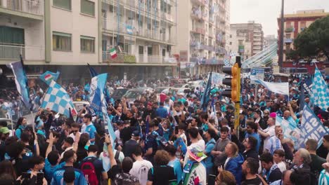 Rising-shot-showing-crowded-italian-fans-cheering-and-celebrating-in-city-of-Napoli