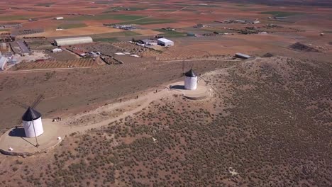 Drone-shot,-pan-left,-point-of-view-movement-over-old-windmills