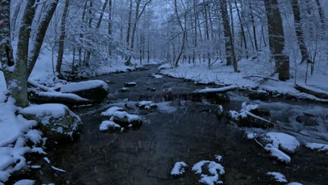 Stunning-slow-motion-footage-of-a-snowy-stream-in-a-winter-wonderland
