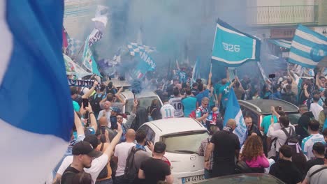 Slow-motion-shot-of-italian-Hooligans-of-SSC-Napoli-celebrating-soccer-Championship-on-road-with-pyrotechnic